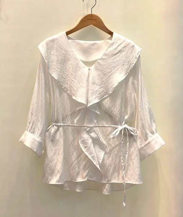 Elegant ruffled design white top, lightweight and breathable.