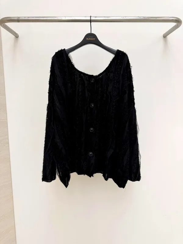 Fashionable black women's top, lightweight and breathable, perfect for pairing with jeans.
