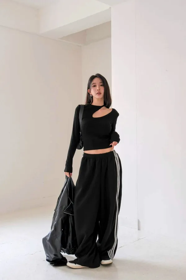 Stylish Black Top with Unique Cut Design for Comfort and Versatility