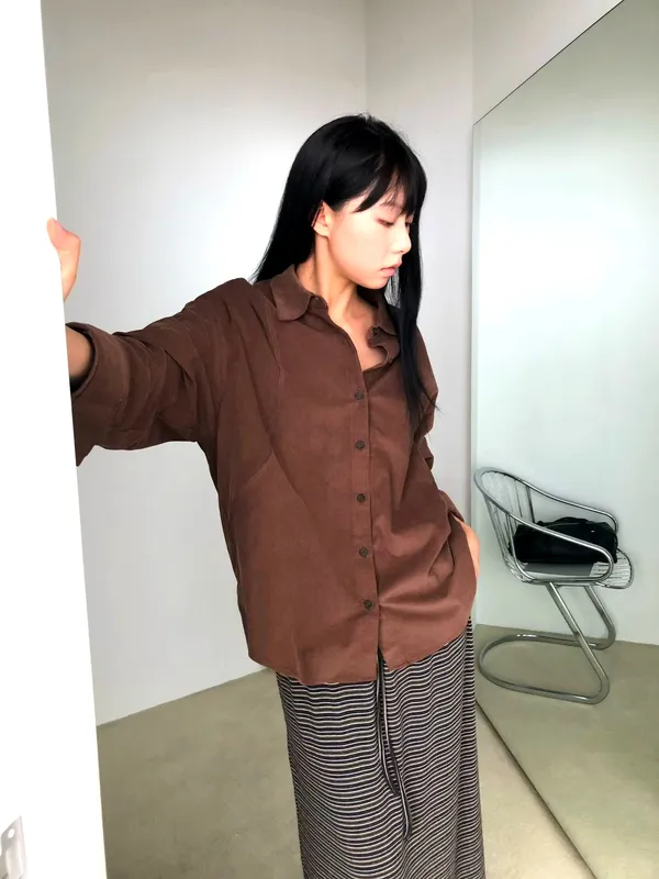 Elegant Brown Shirt, Effortlessly Paired with Fashionable Long Skirts
