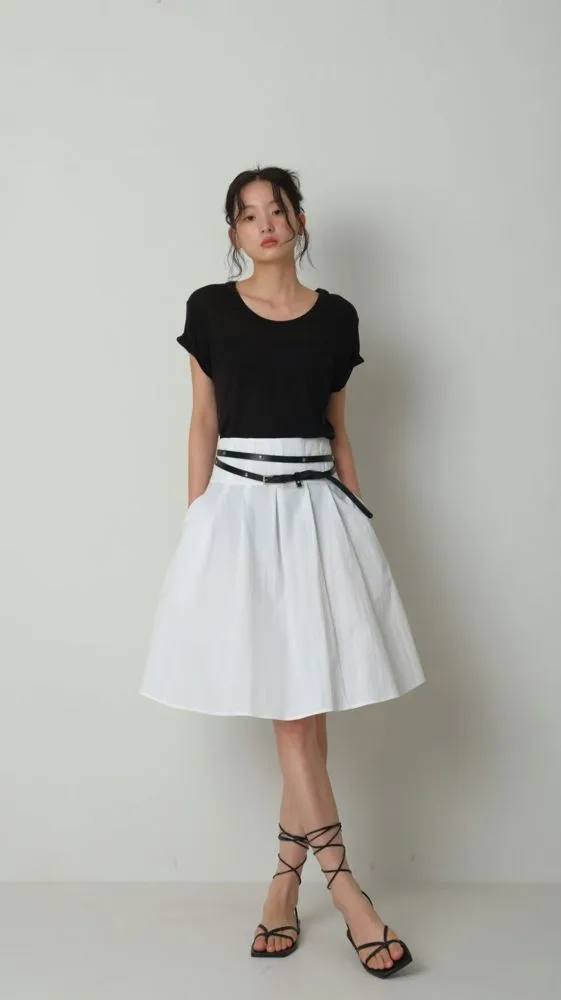 Stylish Black Short Sleeve T-Shirt Paired with White Midi Skirt