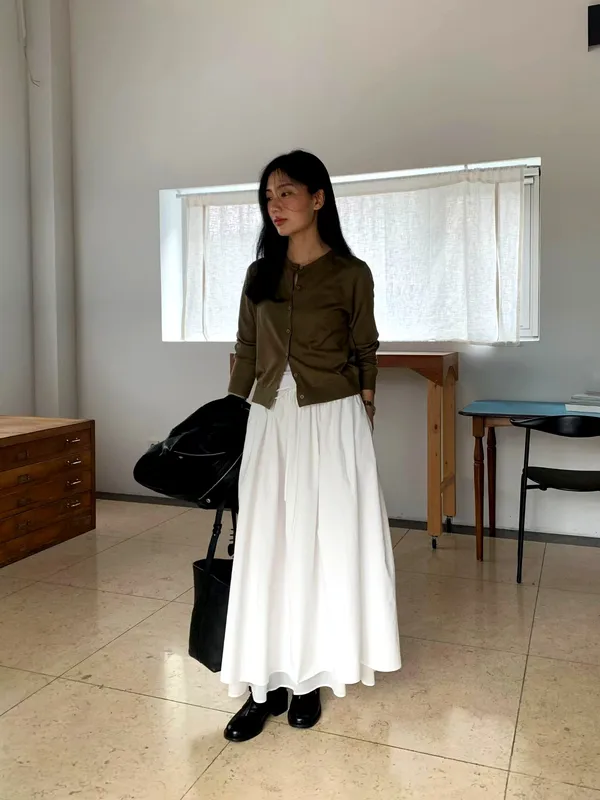 Elegant pleated long skirt, showcasing feminine charm.