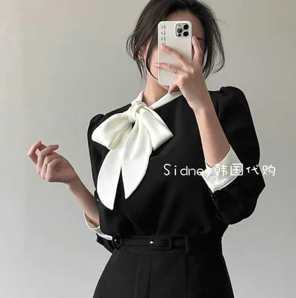 Elegant Black Shirt with White Bow Design