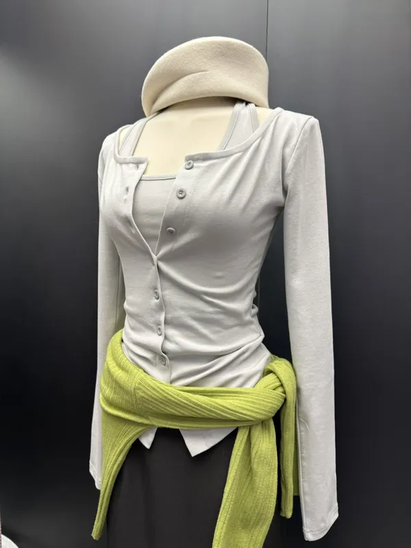 Minimalist White Long Sleeve Shirt Paired with a Stylish Green Sweater
