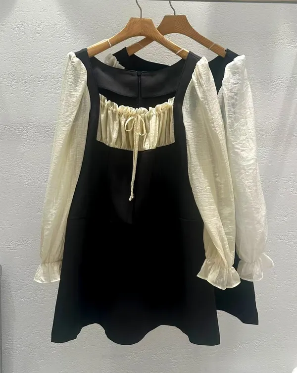 Elegant Women's Dress with Black and White Color Block Design