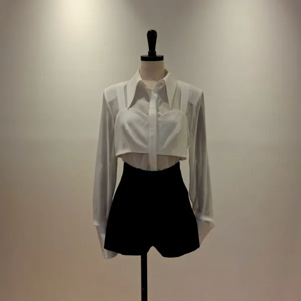 Stylish White Shirt Paired with Black High-Waisted Shorts