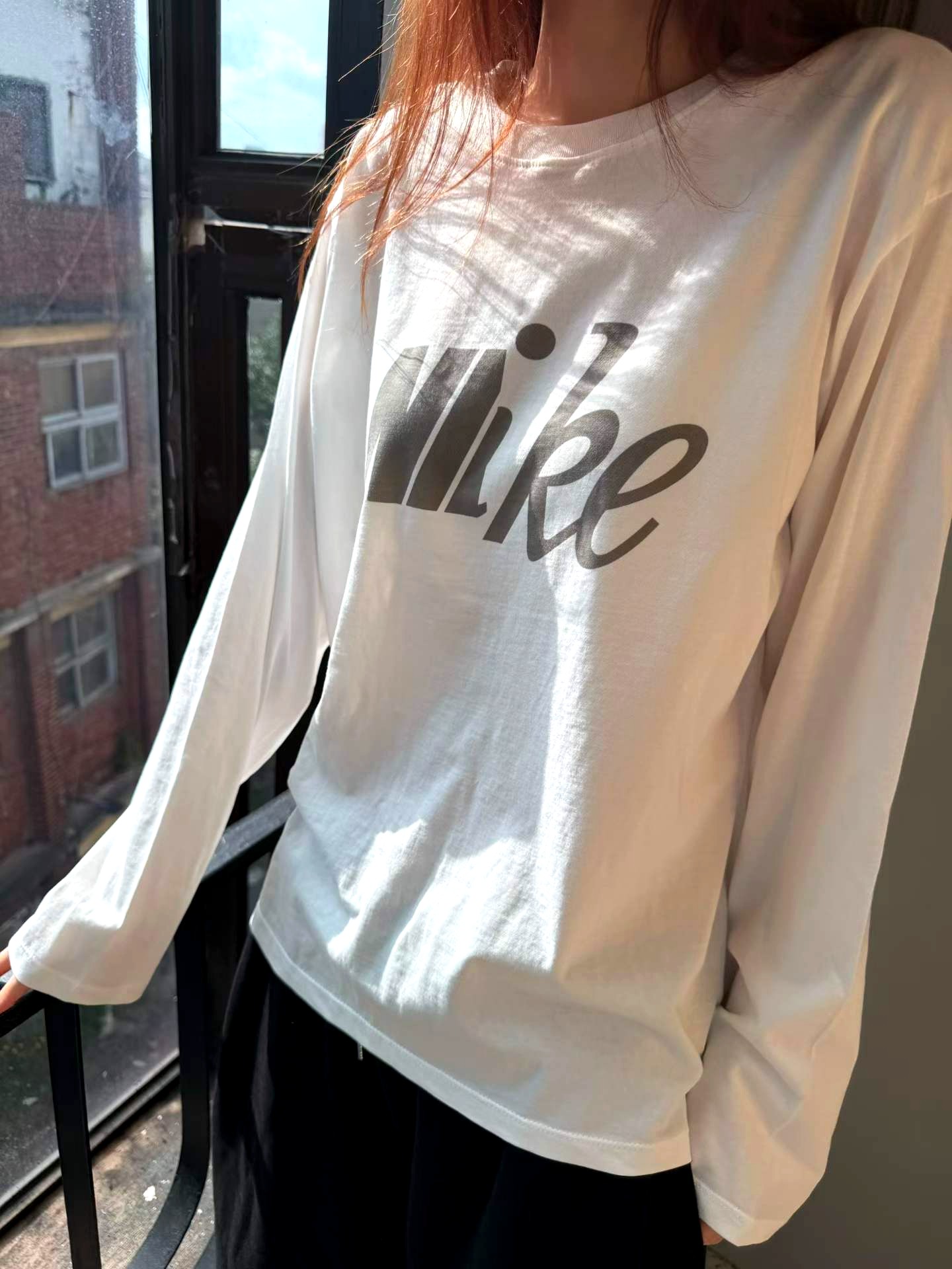 패셔너블하고 편안한 Nike 여성 긴팔 상의