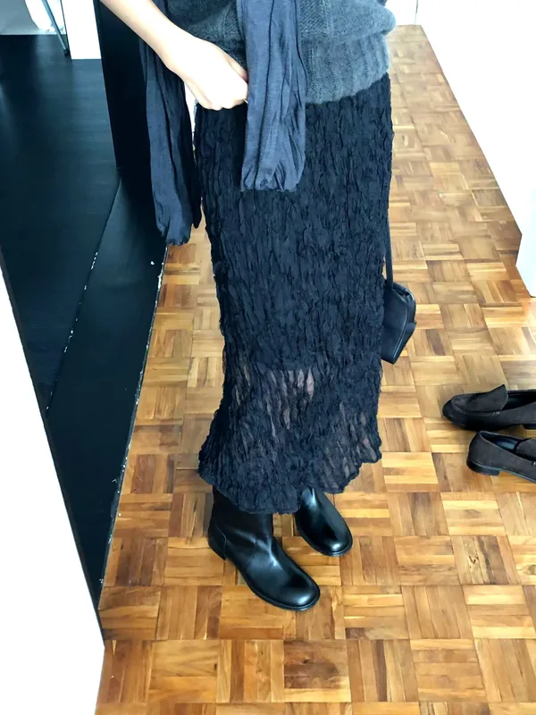 Elegant Black Pleated Skirt, Showcasing Feminine Charm