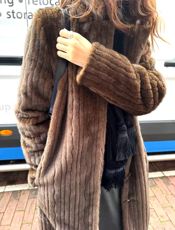 Elegant and fashionable women's fur coat, warm and comfortable.