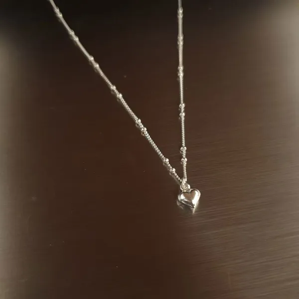 Elegant Heart-Shaped Pendant Necklace in Silver Design
